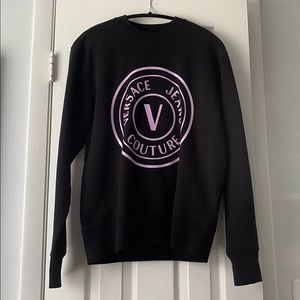 VERSACE crew neck with large holographic pink logo on front